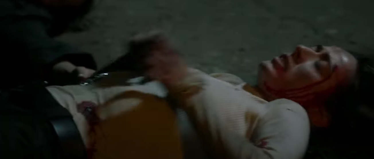 Burgess lying on the floor after being shot by Roy. 