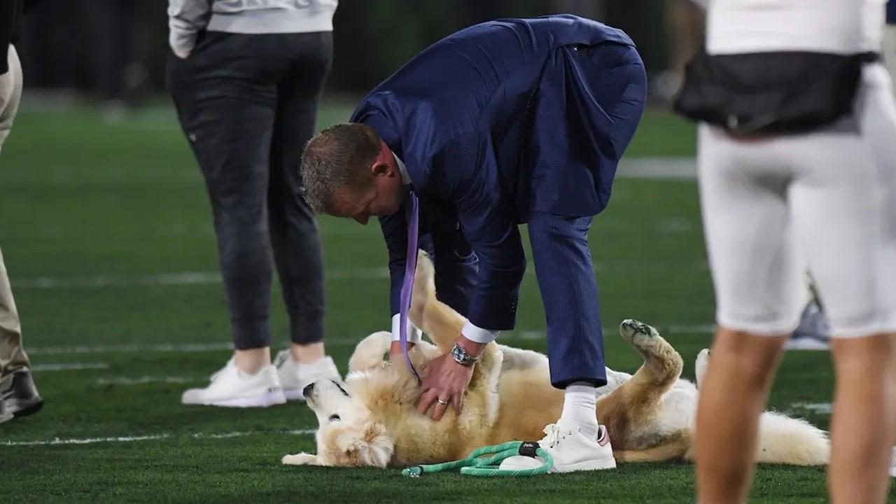 Kirk and Ben Herbstreit on the field before the Ole Miss Rebels and the Georgia Bulldogs game on Nov. 11, 2023