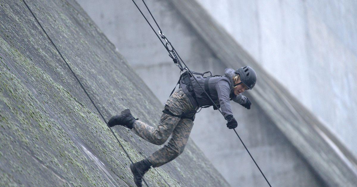 JoJo Siwa scaling a dam on 'Special Forces' Season 2