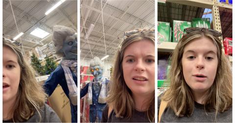 A woman reacts to spooky Christmas décor at Home Depot