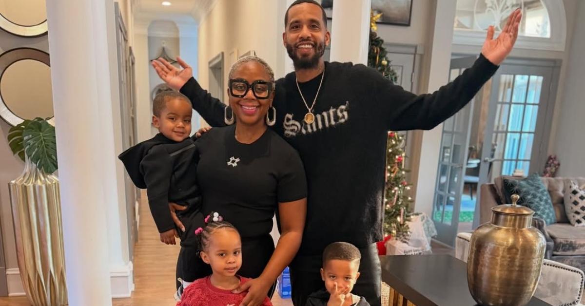 Derrick Hayes and Pinky Cole with their kids in their home.