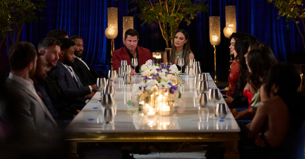 Co-hosts Nick and Vanessa Lachey sit around a table with the Season 3 cast of 'The Ultimatum: Marry or Move On.'