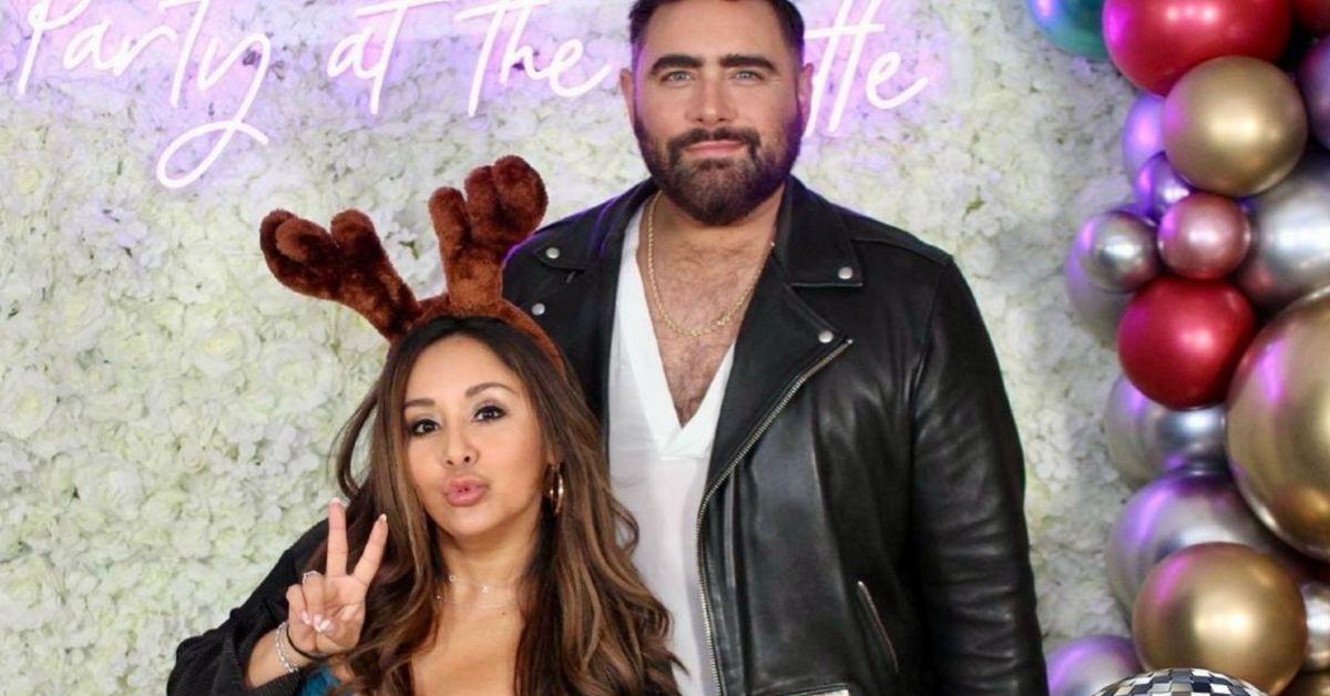 Snooki and Joey Camasta pose for a photo at a party