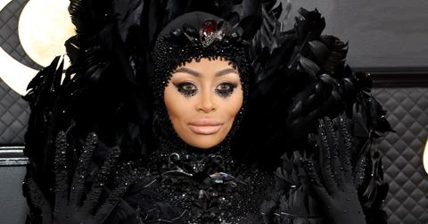 Black Chyna wears dramatic eye makeup and sequined feathered head-to-toe body suit.