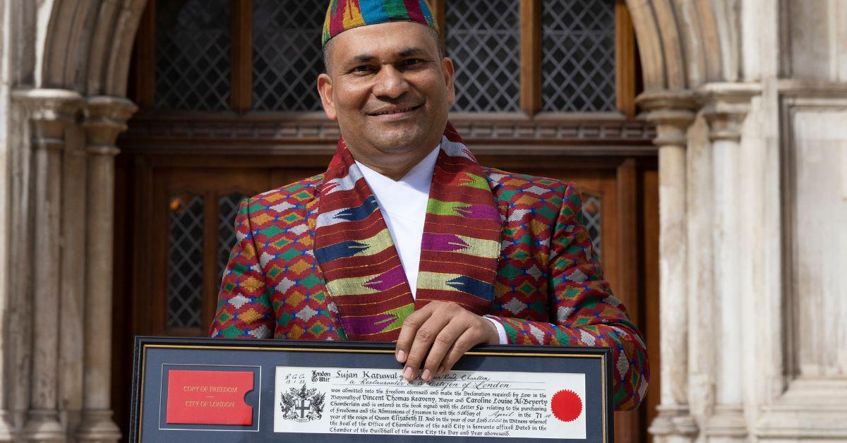 Sujan Katuwal poses after receiving the 'Freedom of the City of London' award