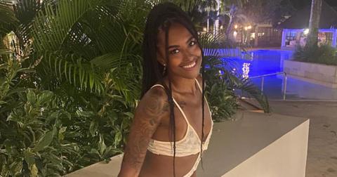 Katina Goode from 'Married At First Sight' wearing a dress by the pool.