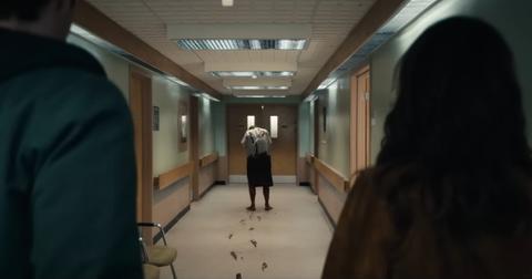 Hughie and Daphne watch as Hugh Sr., covered in blood, walks through the hospital and leaves bloody footprints.