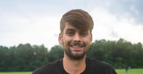 Chandler Hallow poses with merch collection