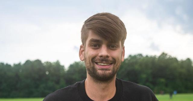 Chandler Hallow poses with merch collection