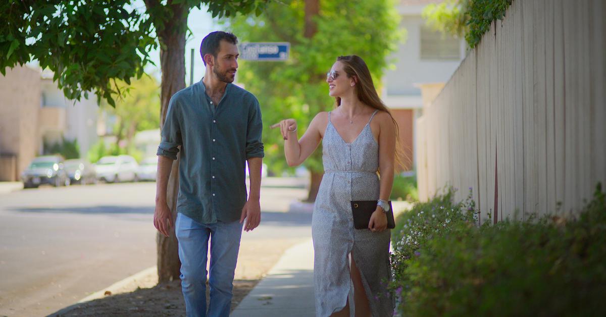 couple walking in a scene from 'Jewish Matchmaking'