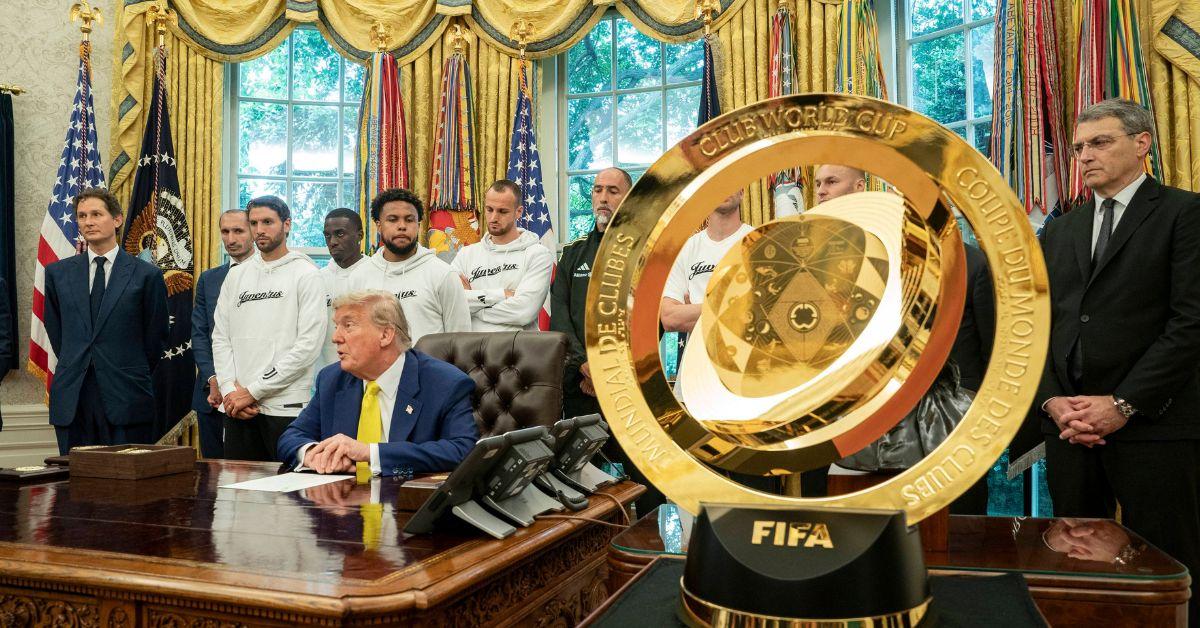 Trump speaking with the FIFA trophy in the foreground. 