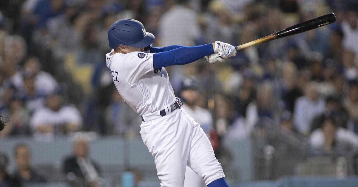 Kiké Hernández hits a ball while playing against the New York Mets at Dodger Stadium in 2019.
