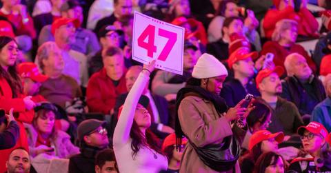 A Trump supporter holding up a 47 sign in Washington, D.C.