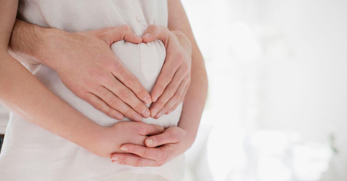 woman pregnant holding bump