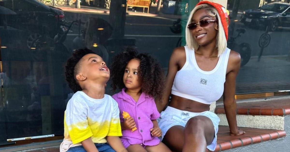 Chelsea Lazkani poses in front of an ice cream store with her kids