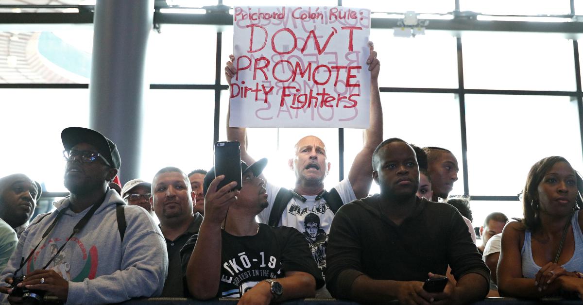 Prichard Colón's dad, Richard, protests during the Premier Boxing Championship, WBC World Welterweight Championship weigh-in at Barclays Center on Sept. 7, 2018 