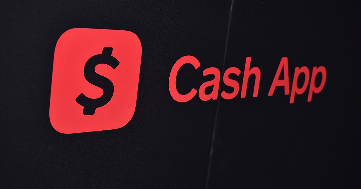 The Cash App logo in red on a screen. 