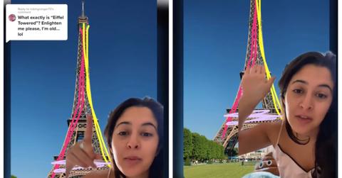 A woman pointing to the Eiffel Tower and offering an explanation on TikTok