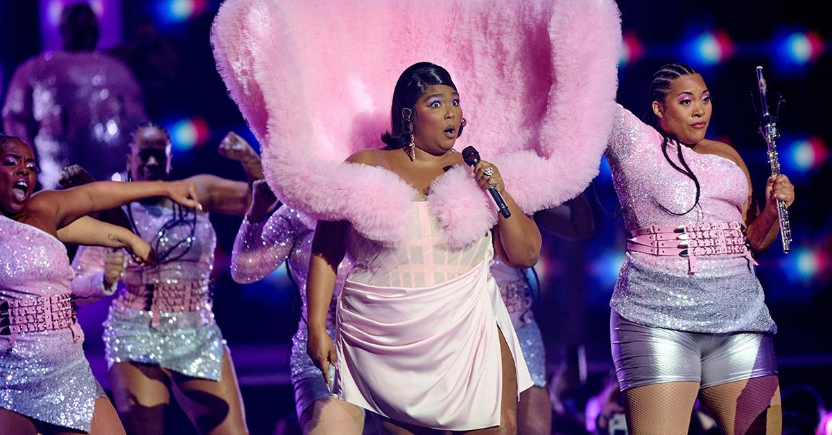 Lizzo performs at the BRIT Awards in Pink. 