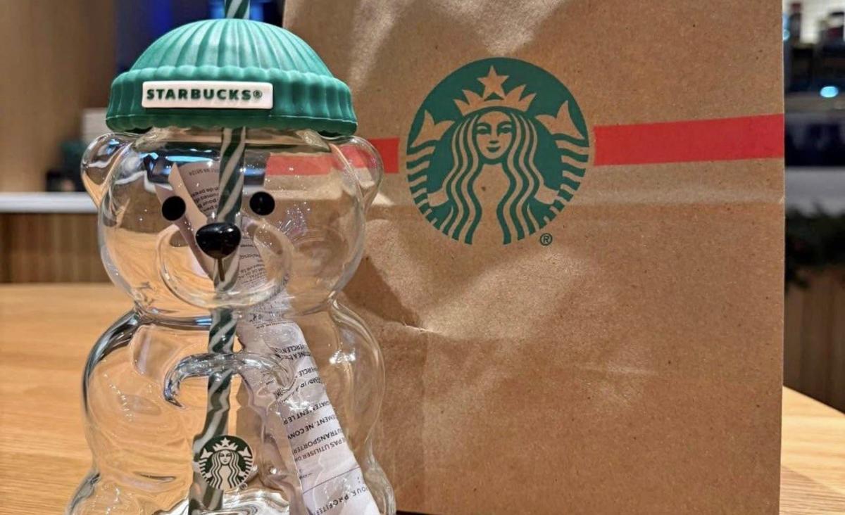 The Starbucks Bearista cup with a bag in the restaurant.