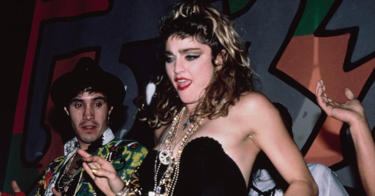 Madonna dancing in a black dress in 1985