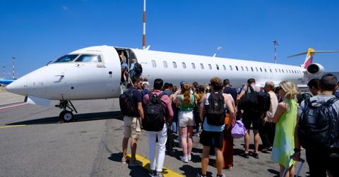 Passengers board a Bombardier CRJ1000 (EI-HBB) from Hibernian Airlines