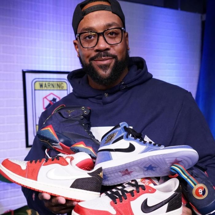 Marcus Jordan with shoes from his store