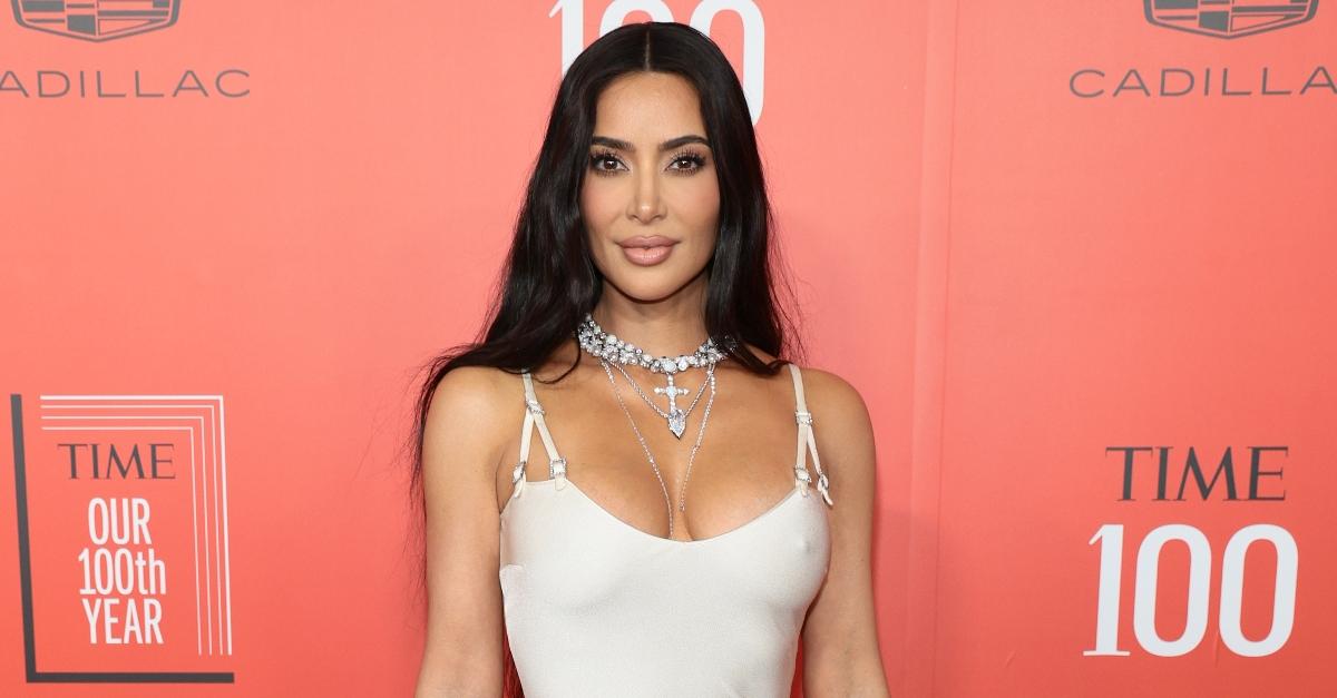 Kim Kardashian poses in a white dress at 2023 TIME100 Gala at Jazz at Lincoln Center 