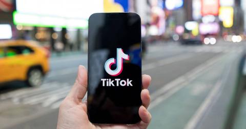 A TikTok logo on a phone in New York City.