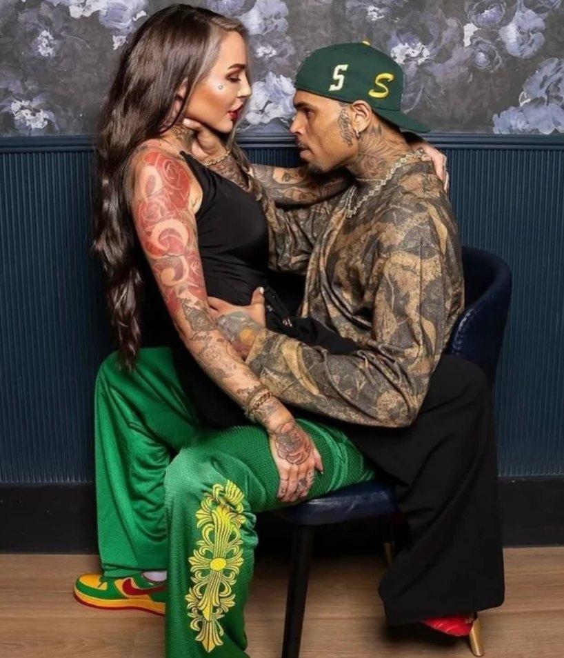 Chris Brown holding woman by the neck for meet-and-greet-photos.