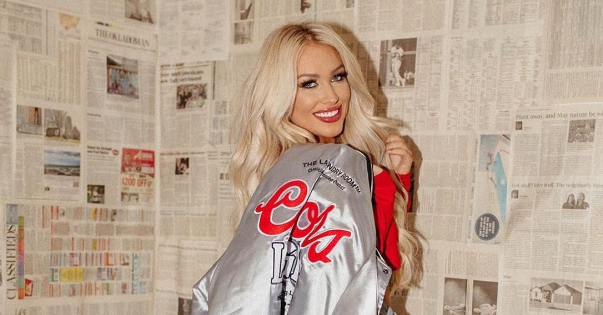 Mady shows off wares from the Vintage Leopard x Coors Light collaboration.