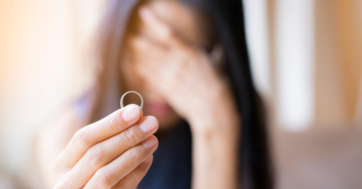 the woman holds the wedding ring and weeps she was abandoned by her picture id