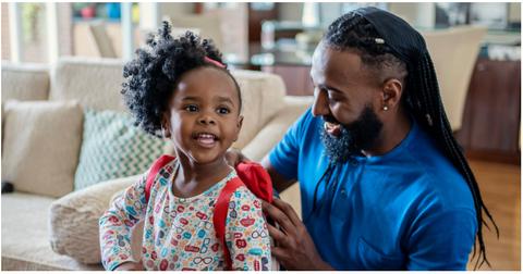 (l-r): A girl getting ready with her dad in the living room