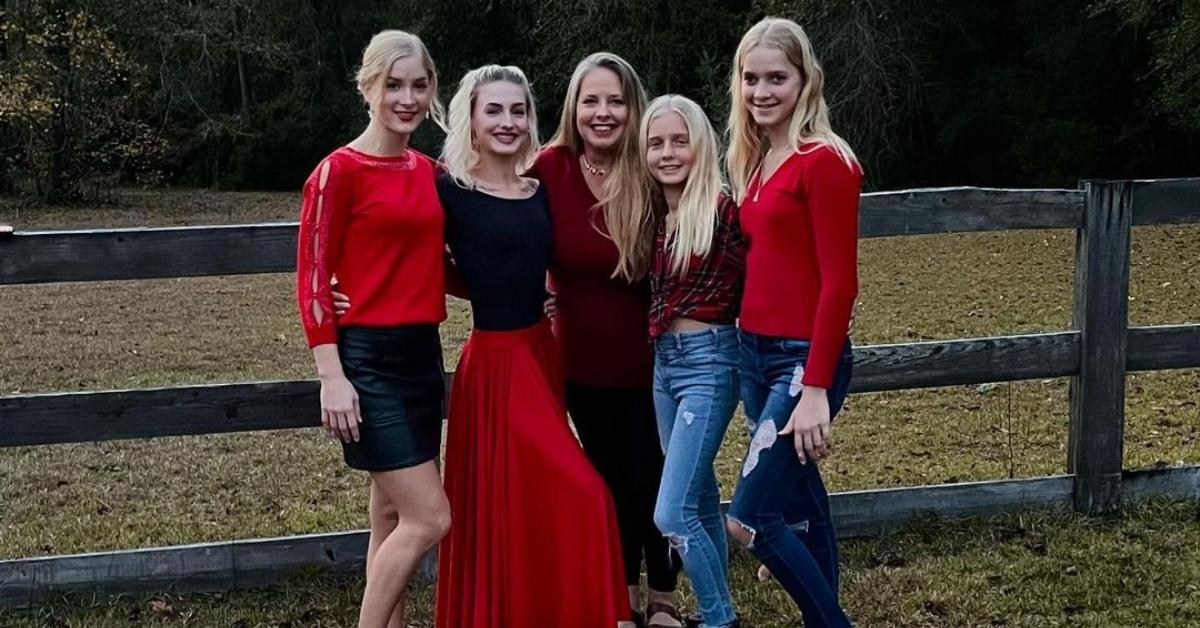 Kim Plath with her daughters on a farm