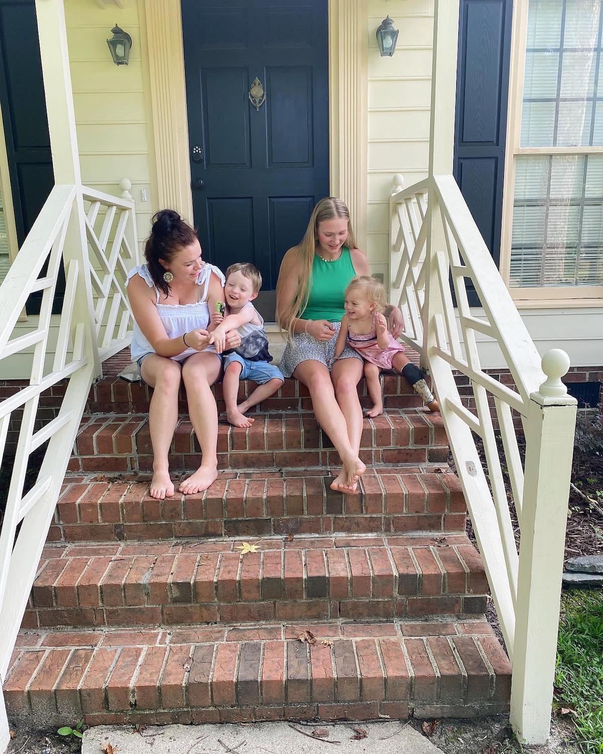 Ysabel Brown sitting with Maddie and her kids