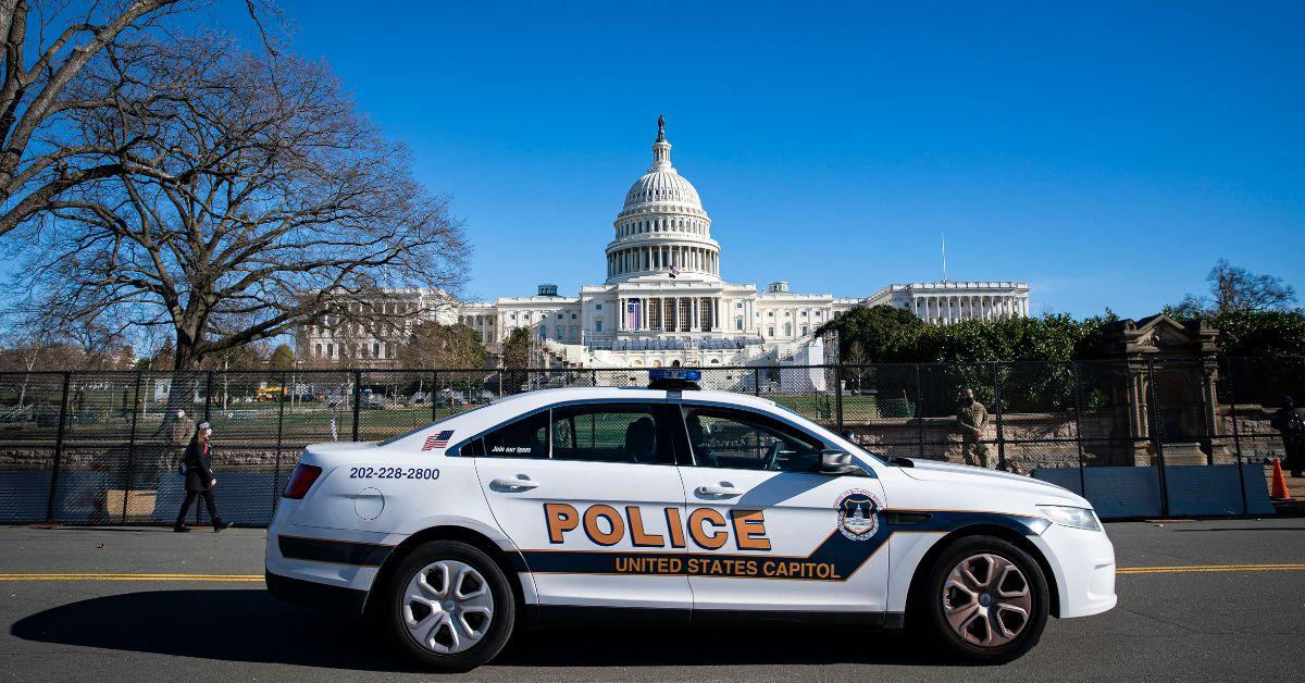 A police car in front of the Capitol Building in Washington D.C.