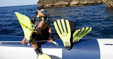 Scuba divers diving backwards
