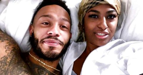 Olajuwon and Katina on 'MAFS' laying in bed together.