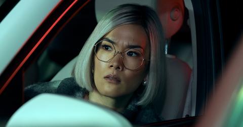 Ali Wong in 'Beef' with blond hair sitting in a car