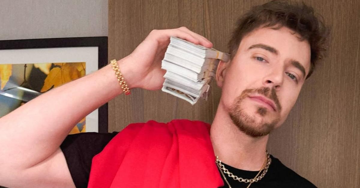 MrBeast holding a stack of money