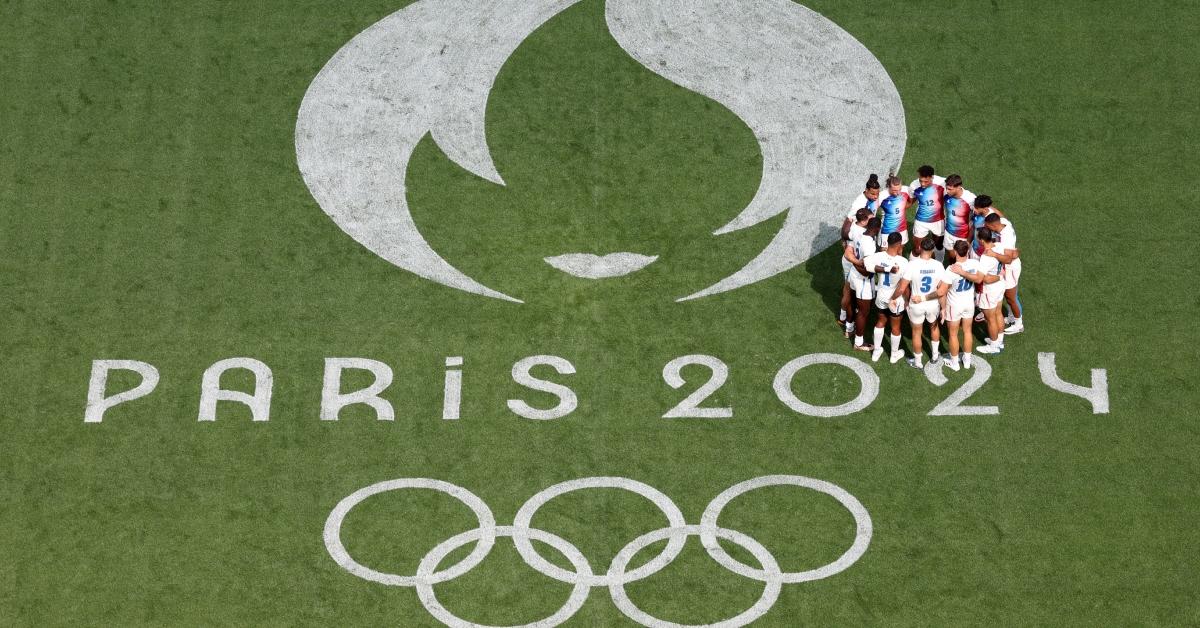 Players of Team France enter a huddle prior to the Men's Rugby Sevens Pool C Group match of the Olympic Games Paris 2024 at Stade de France on July 24, 2024.