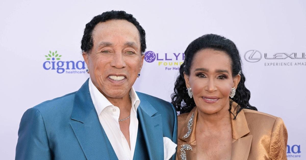 (l-r): Smokey Robinson and Frances Gladney attending an event.