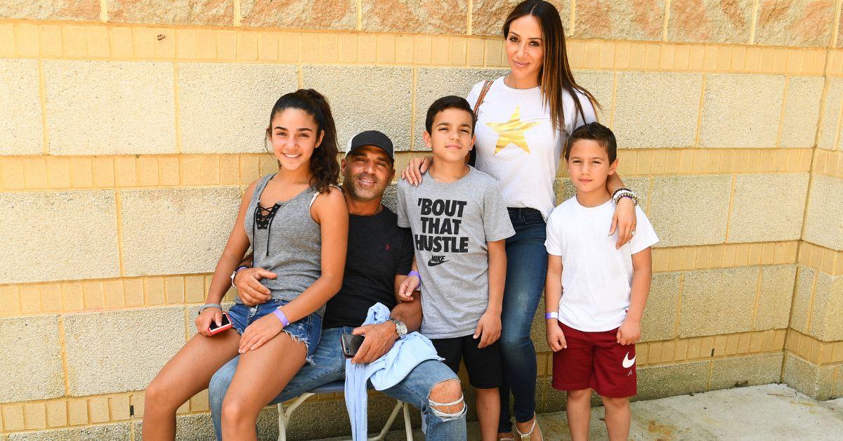 The Gorga family poses for a photo at Teresa Giudice's body building event in 2019.