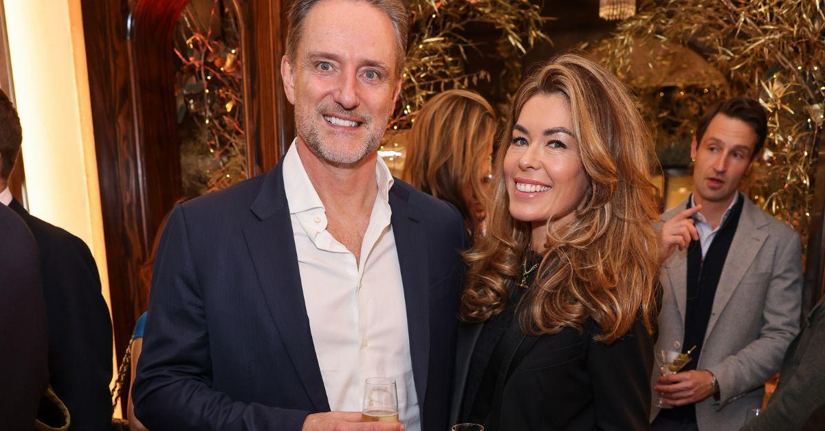 Sophie Stanbury poses for a photo with Mark Wilson at an event