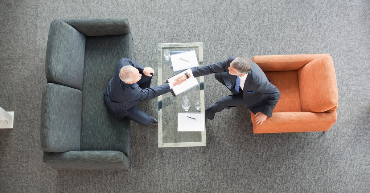 Businessmen shaking hands at the office.