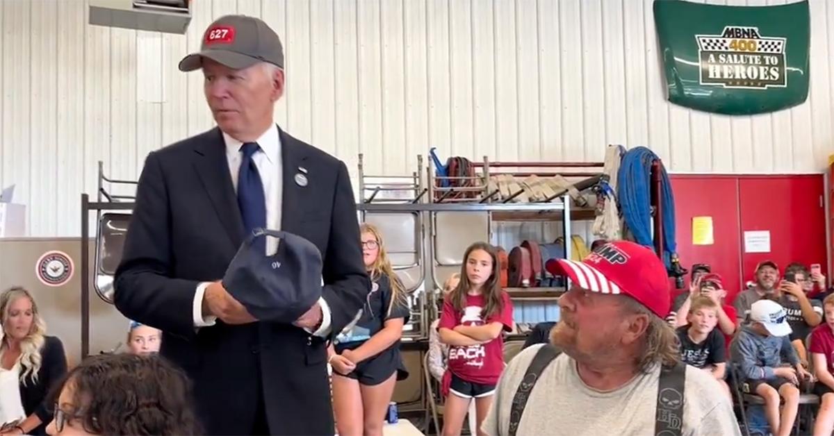 Joe Biden talking to a Trump supporter in a firehouse. 