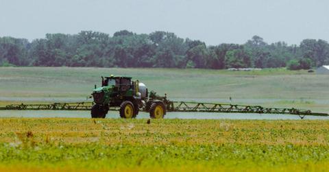 A tractor riding on the McBee family farm.