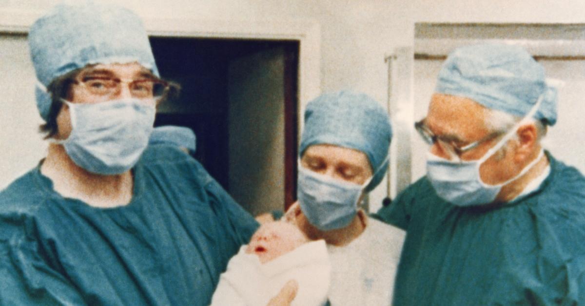 Doctors holding Louise Brown, the first IVF baby, born July 25, 1978.