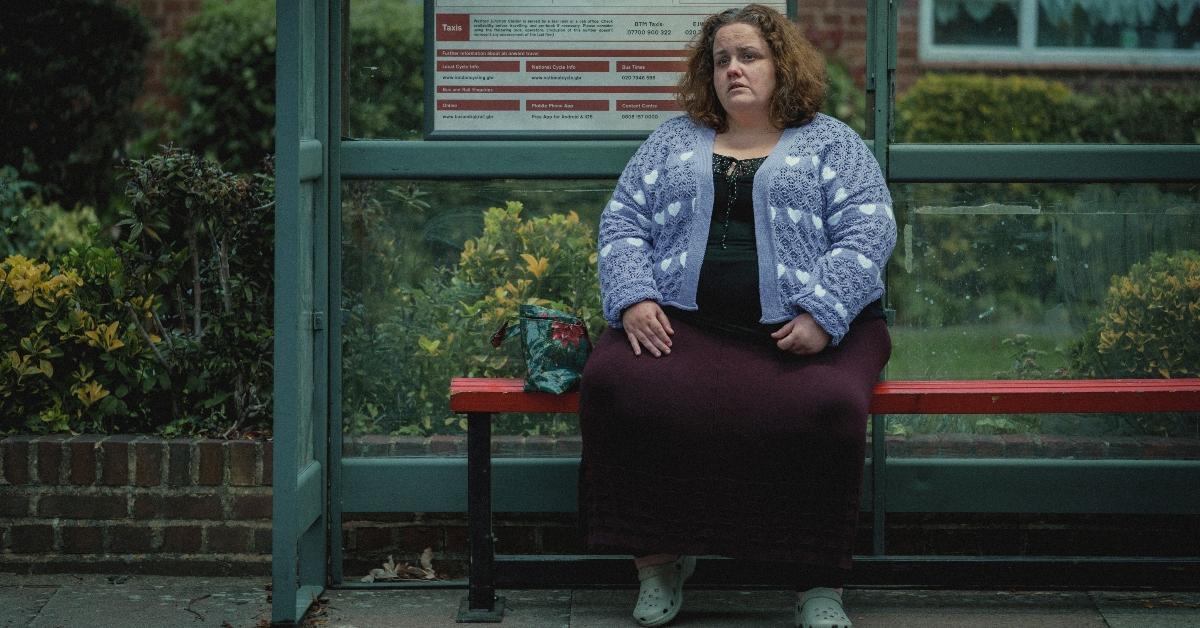 Jessica Gunning as Martha waits at a bus stop across the street from Donny's (Richard Gadd) house.