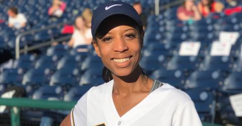 Mia Love smiling while wearing a baseball cap